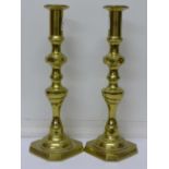 A pair of brass candlesticks,