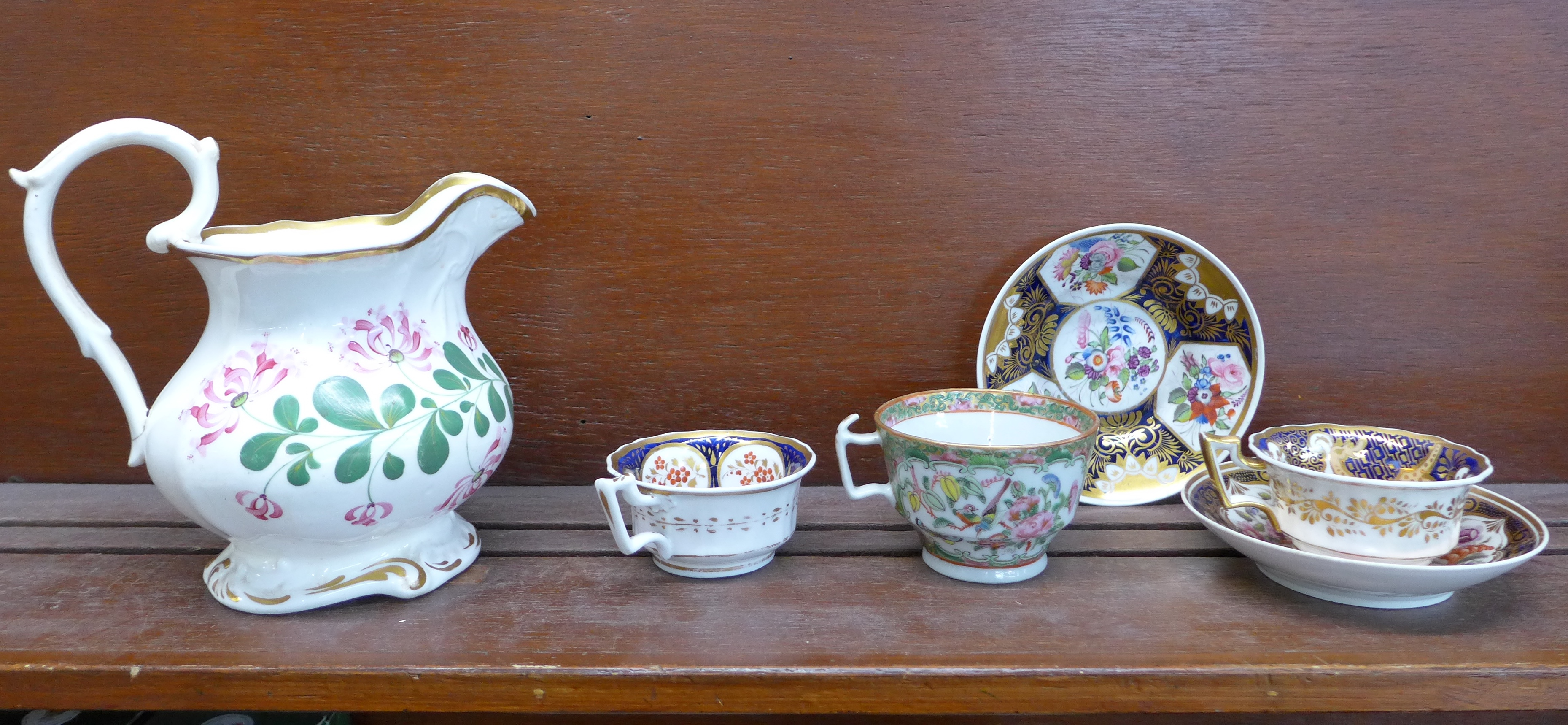 A Chinese famille verte cup, two early cups and two saucers and a jug, a/f,