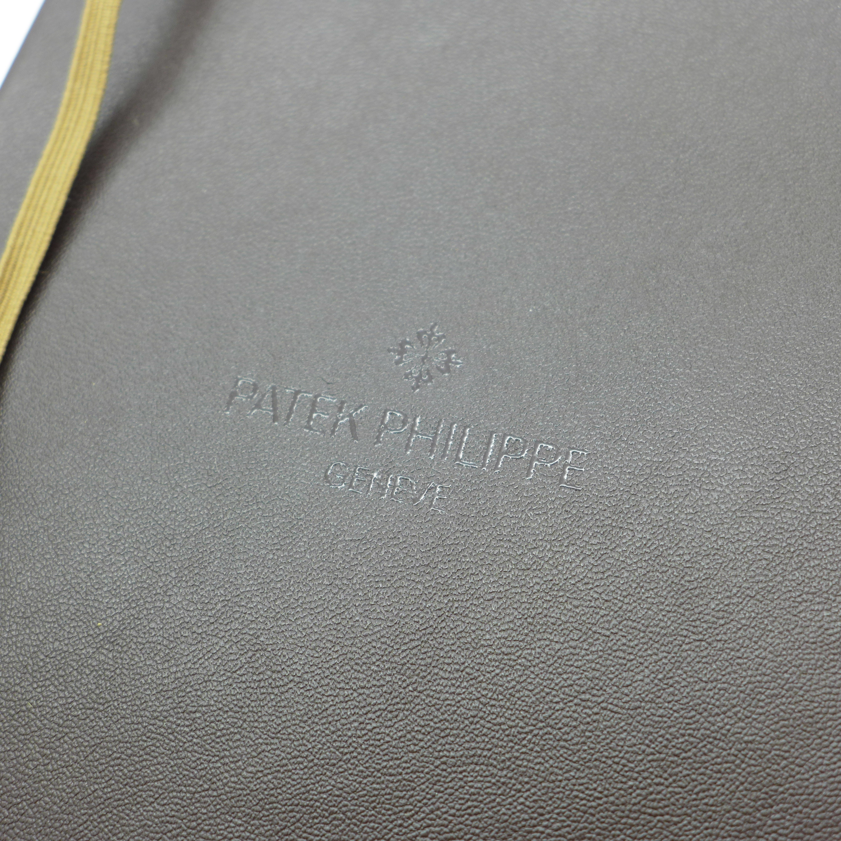 A Patek Philippe notebook and two cases marked Officine Panerai - Image 3 of 4