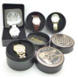 Four modern wristwatches with coin dials