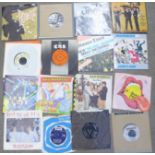 A collection of 7" 45rpm records including Bowie, The Jam, etc.