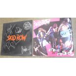 A Skid Row 12" single, Slave to the Grind, signed, with rubber sleeve