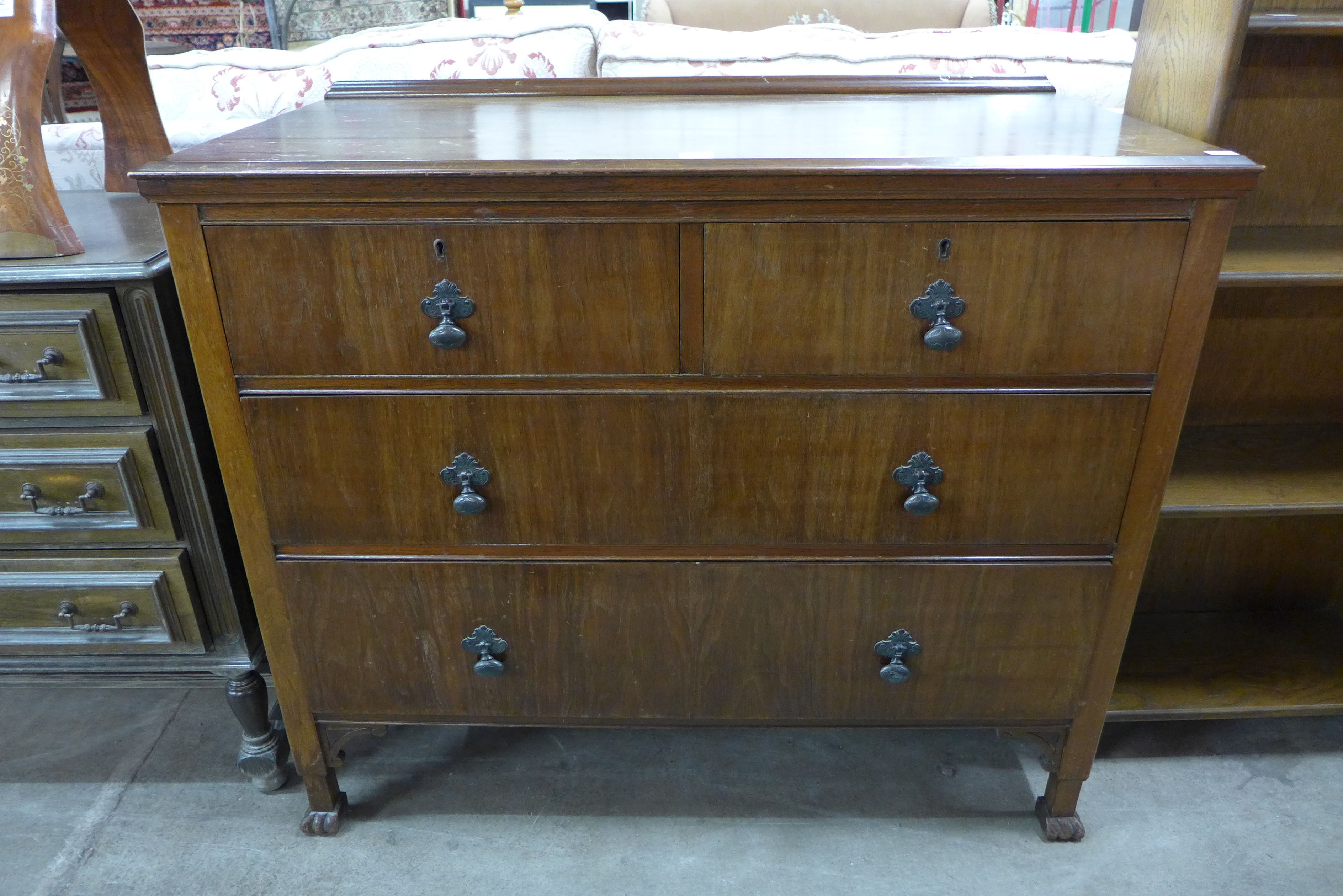A 1930's walnut chest of drawers