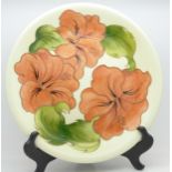 A Moorcroft hibiscus plate, 25.