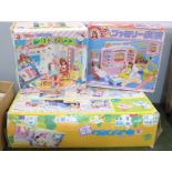 Three Japanese children's playsets including Hello Kitty,