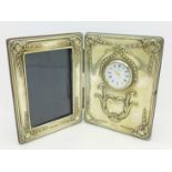 A silver frame and mounted watch combination by Carr,