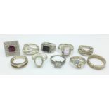 Ten silver rings,