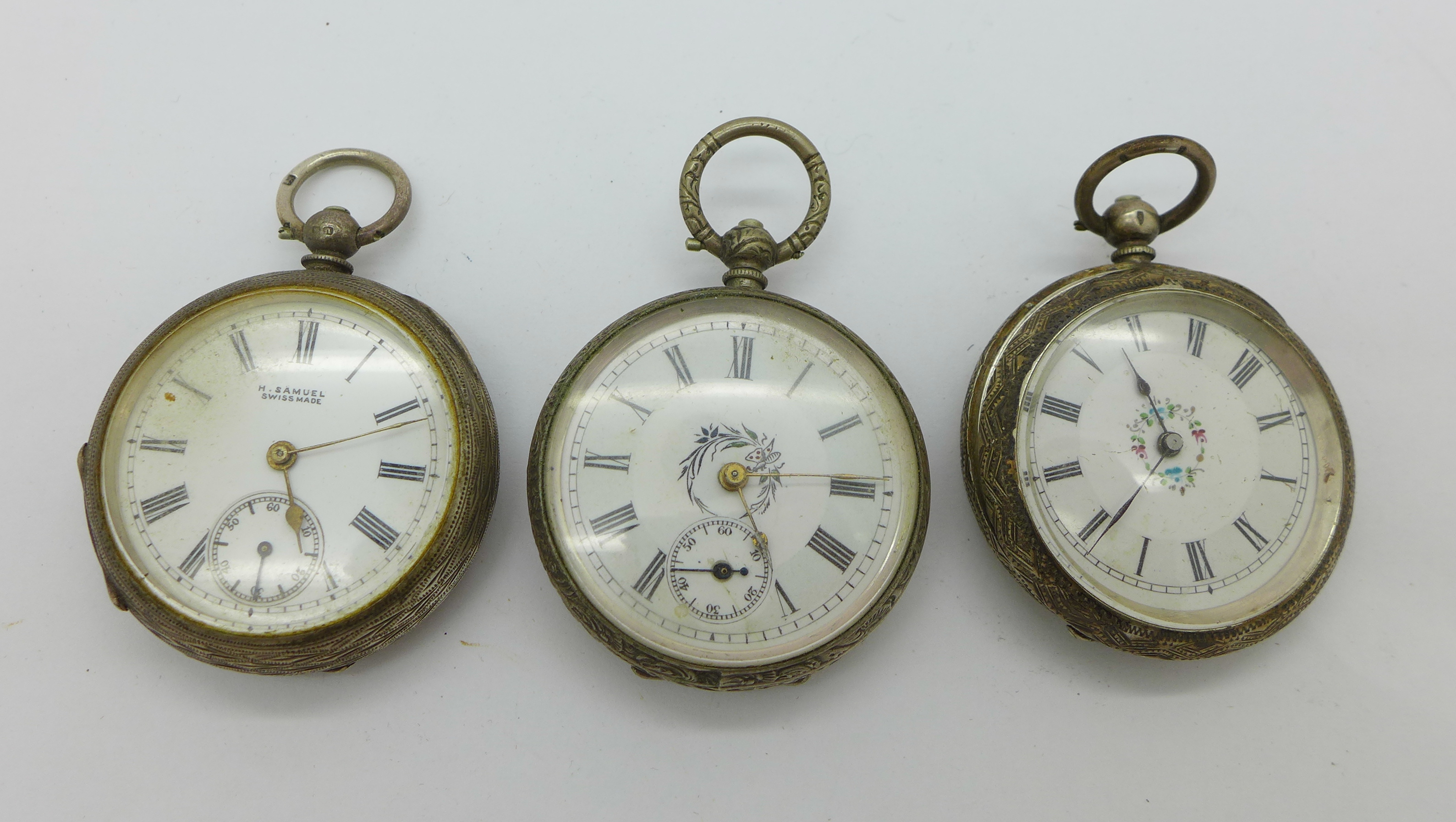 Three silver cased fob watches,