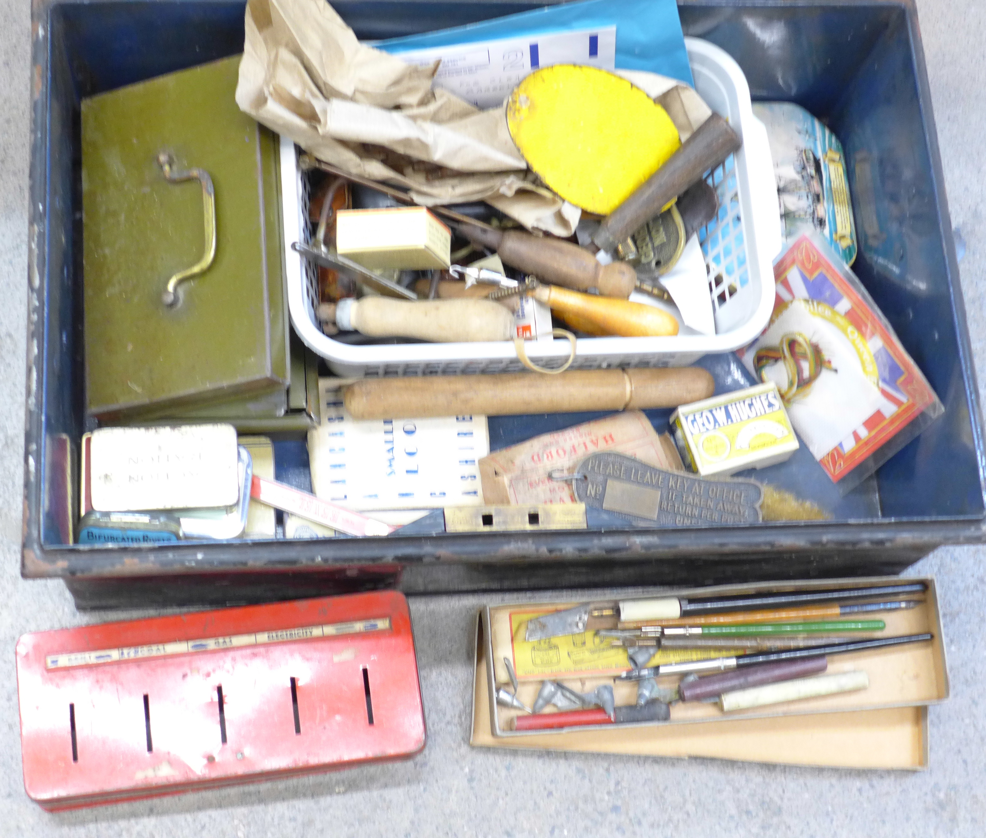 A tin trunk with other tins, old keys, hobby tools, etc.