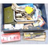 A tin trunk with other tins, old keys, hobby tools, etc.