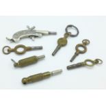 A novelty pistol watch key and six other watch keys