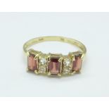 A 9ct gold, garnet and white stone ring, 1.
