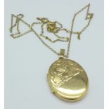 A 9ct gold locket and chain, 7.