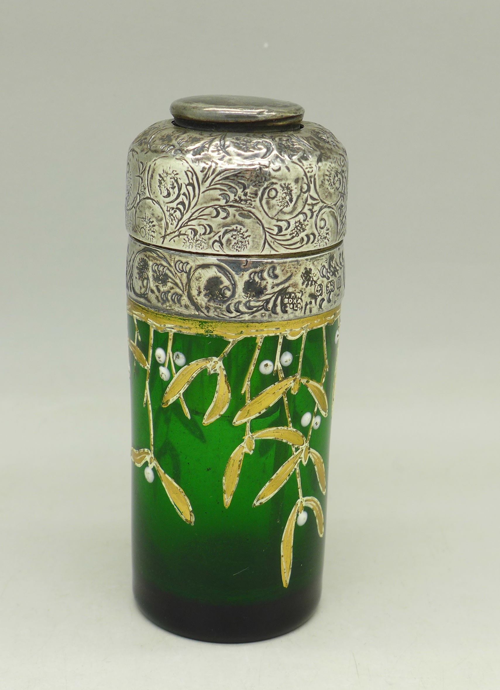 A silver mounted green glass scent bottle