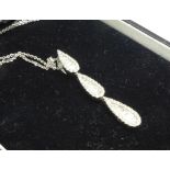 An 18ct white gold and diamond pendant and chain, approximately 1carat diamond weight, length 39cm,