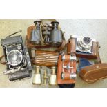 A Voigtlander VitoB camera, a pair of field glasses,