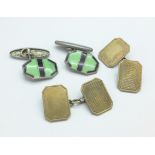 A pair of enamel cufflinks marked Lambournes,