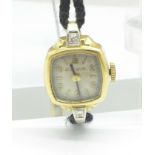 A lady's 9ct gold cased and diamond set Bulova cocktail wristwatch