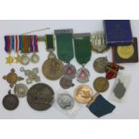 A collection of medallions and miniature medals including one silver fob medal