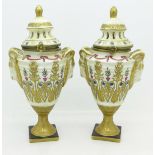 A pair of continental pot pourri pots with gilt decoration and hinged lids, 17.
