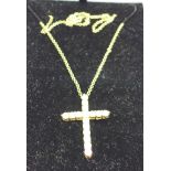 A 9ct gold stone set cross pendant,