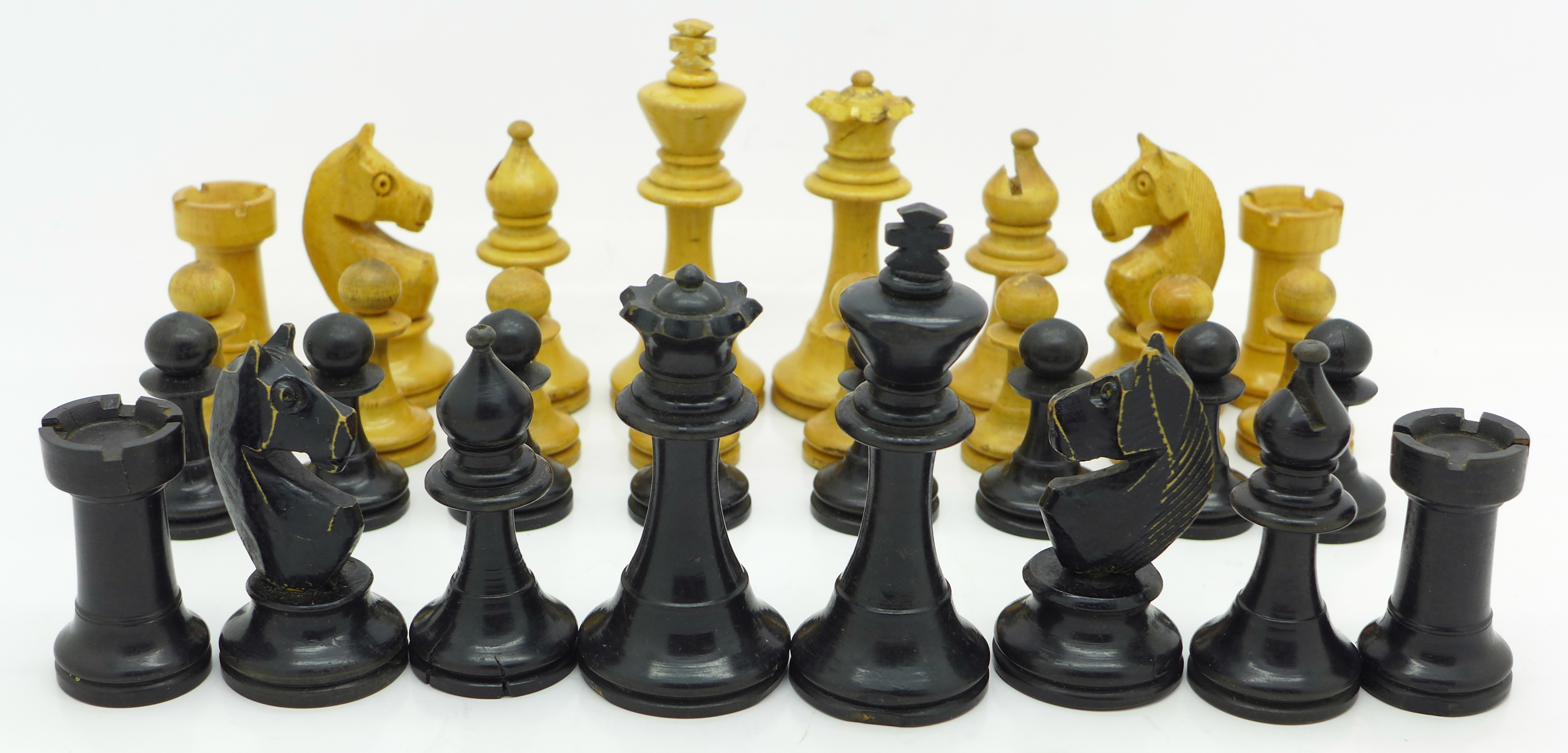 A chess set, boxed, height of king 73mm,