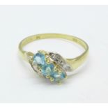 A 9ct gold, blue topaz and diamond ring, 1.