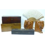 Two boxes and a fan, boxed, and a pair of heavy carved wood elephant bookends,