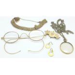 A yellow metal fronted brooch, lacking pin, a plated bracelet, a pair of spectacles, etc.