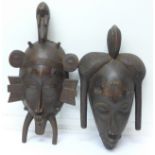 Two carved African tribal masks