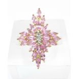 A 9ct gold ring set with pink sapphires, 5g,