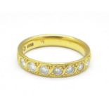 A 22ct gold and seven stone diamond ring, 5.