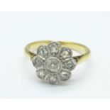 A yellow metal and diamond flower ring, 3.