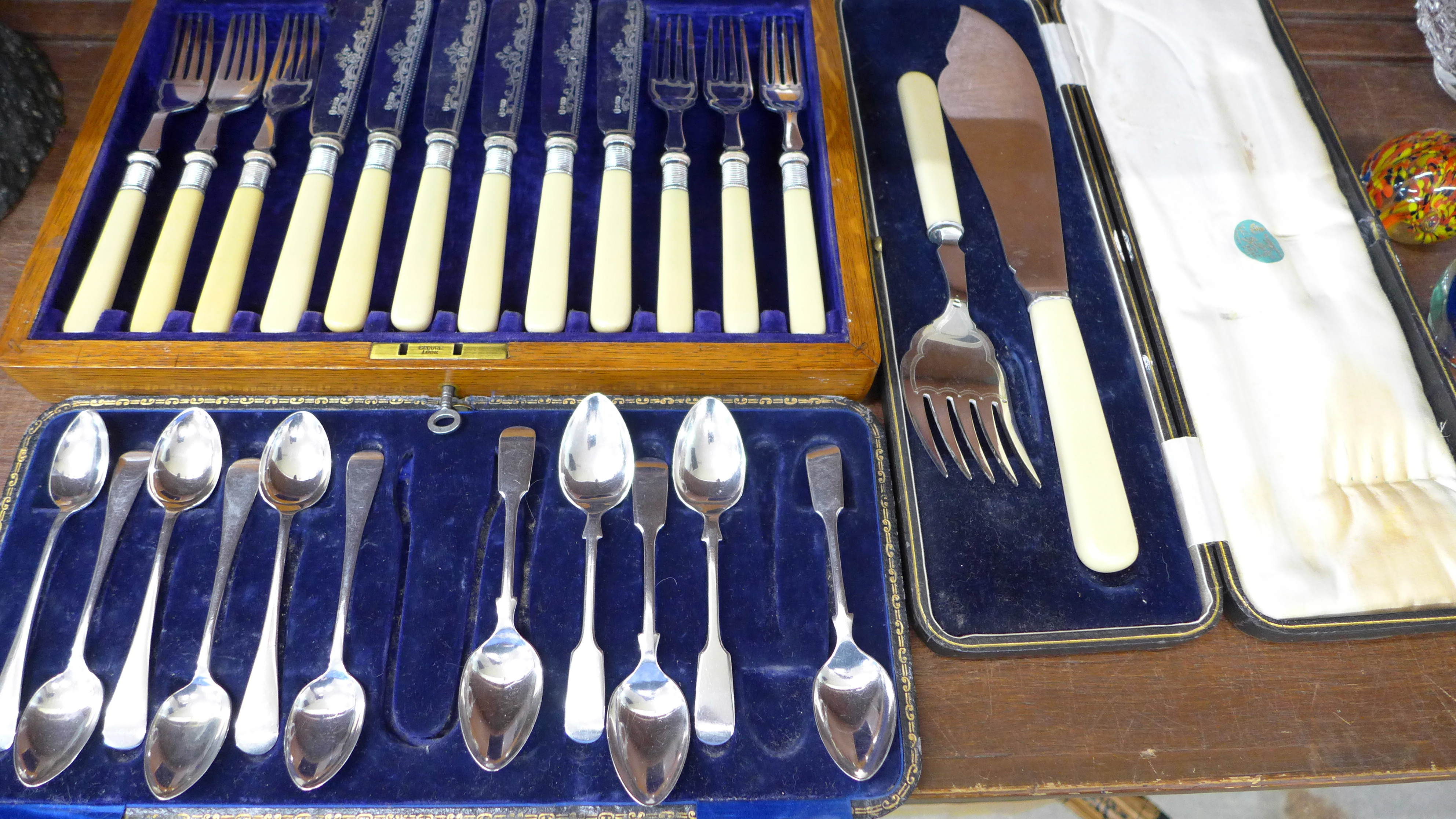 Three cased sets of flatware including fish knives and forks,