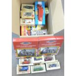 A box of die-cast vehicles including Lledo,