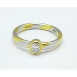 An 18ct gold and diamond ring, set with an oval diamond, 5.