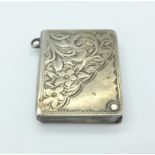 A silver postage stamp case,