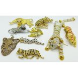 Eight stone set cat brooches including one large articulated and a cat pendant