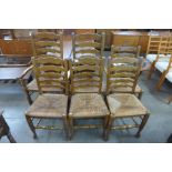A set of six beech rush seated ladderback dining chairs