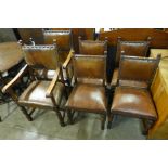 A set of six oak and brown leather dining chairs