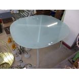 A vintage Habitat glass topped table on metal base