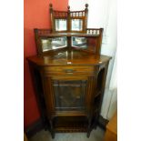 A Victorian walnut corner cabinet