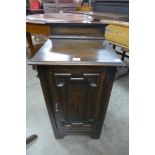 An oak bedside cupboard