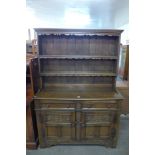 A carved oak dresser