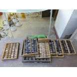 Eight small printers trays and type
