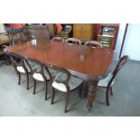A Victorian style mahogany extending dining table and eight balloon back chairs