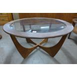 A G-Plan Astro teak and glass topped circular coffee table