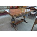 A carved oak draw-leaf refectory table