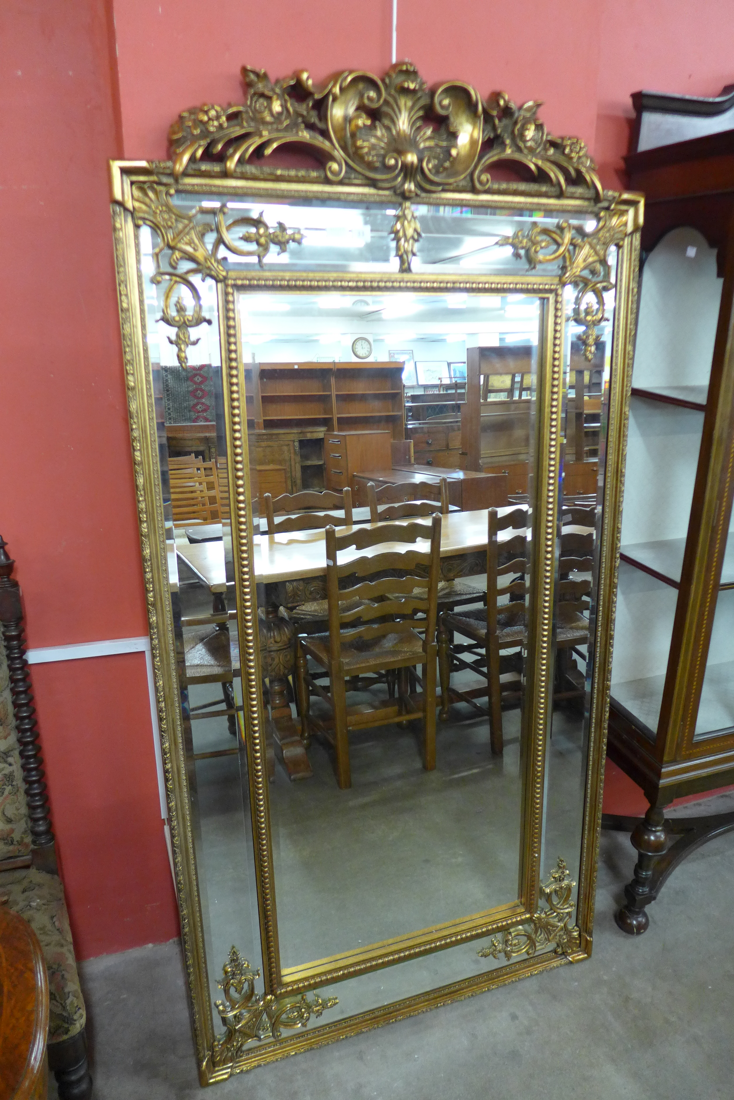 A large French style crested gilt framed mirror, 185 x 92cms,