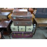 Two steamer trunks and three suitcases